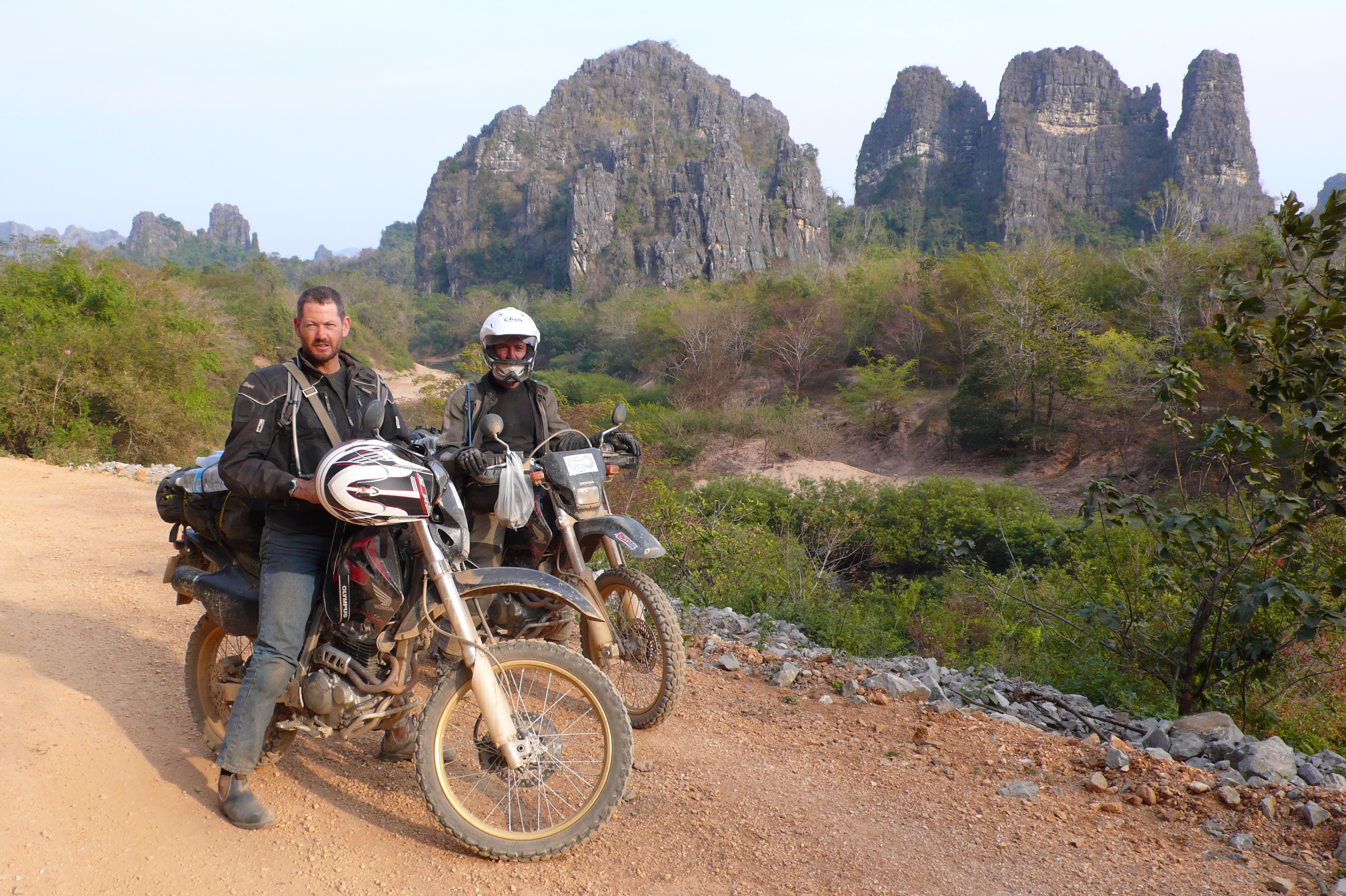 Explore Indochina riders stopped by some karst