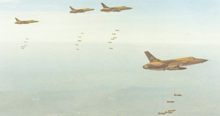 A formation of Thud F-105 bomber jets releasing their payload.