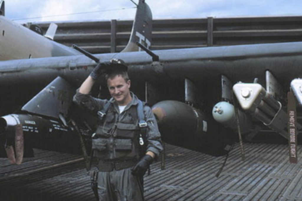 a soldier by an A1 Skyraider