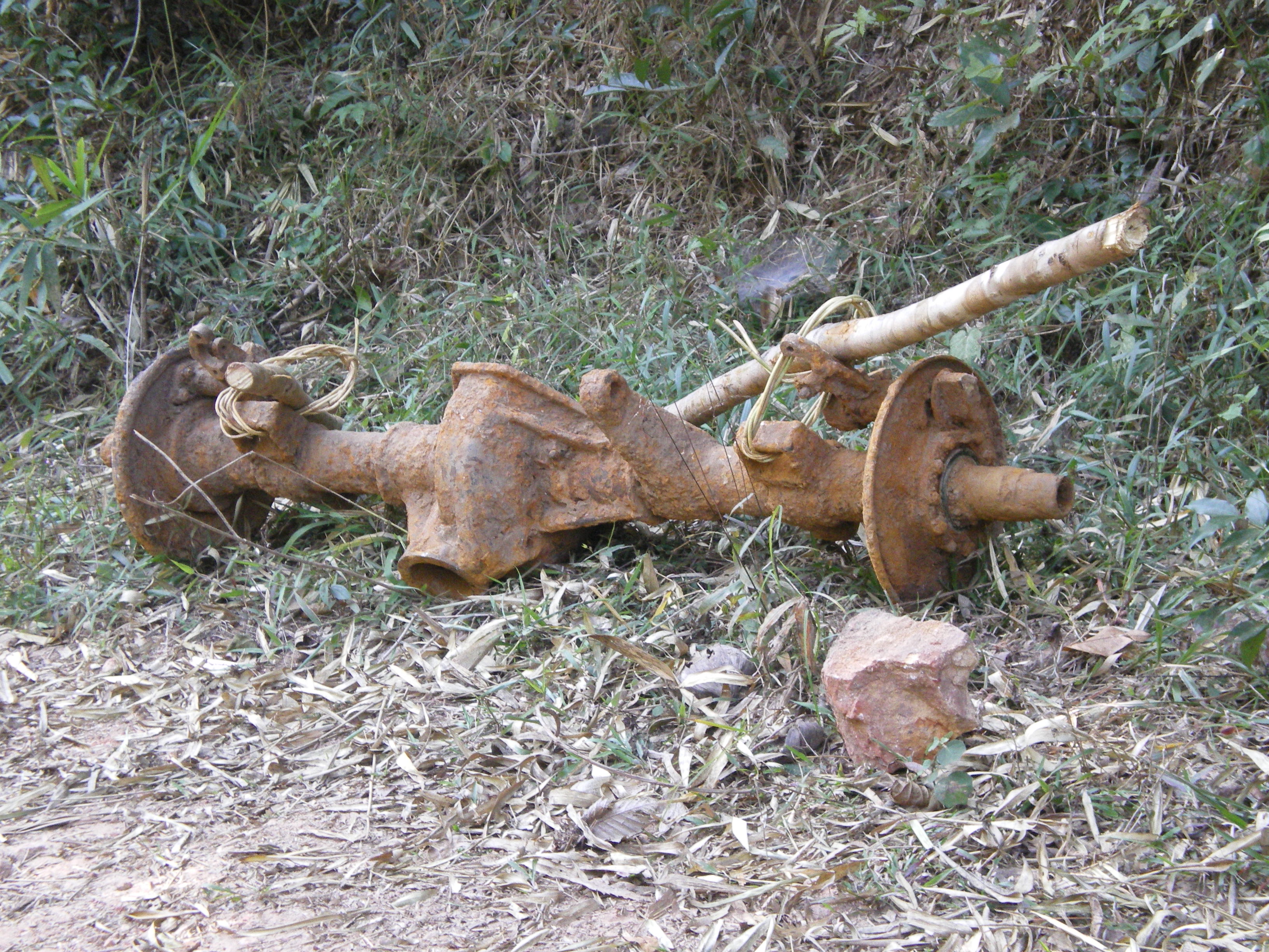 a truck axle dragged out of the jungle south of Ta Oi