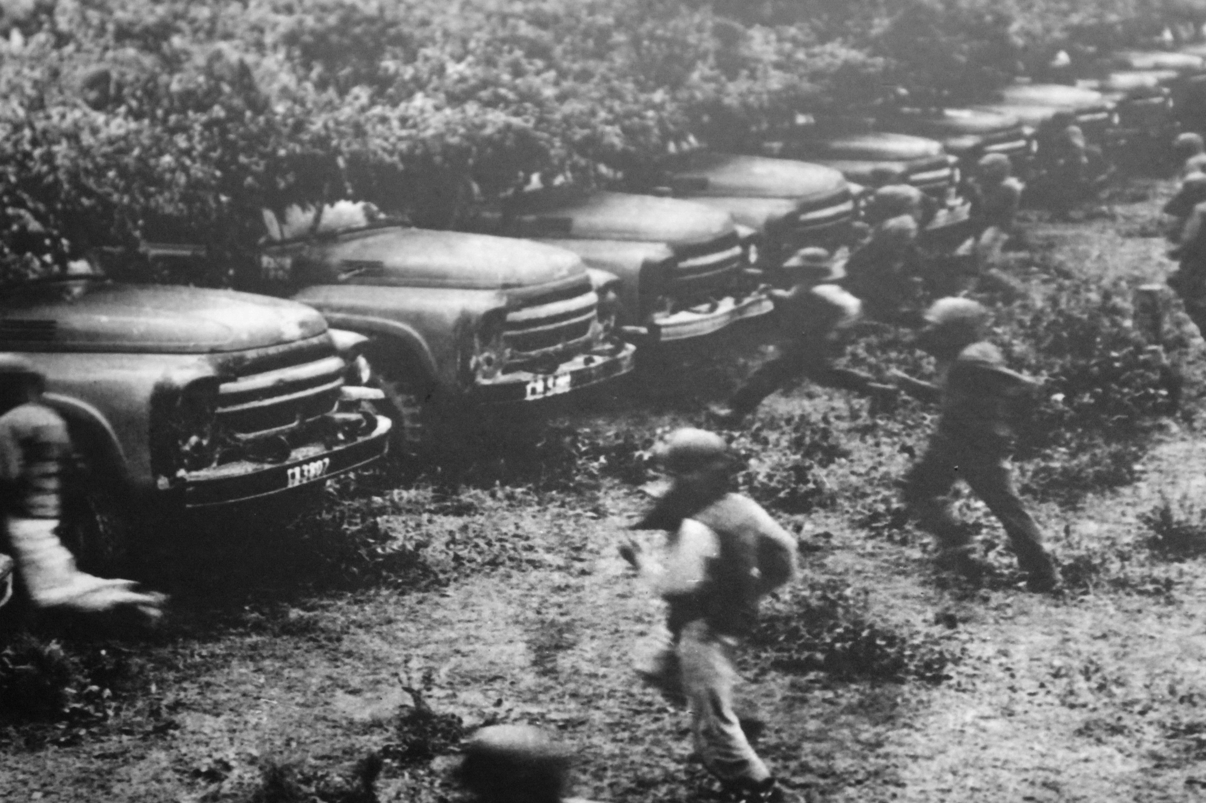 row of trucks photographed during the Vietnam War