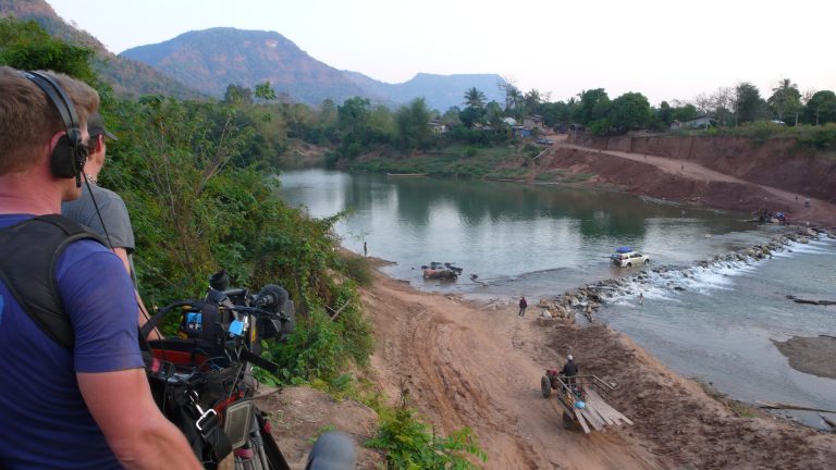 BBC cameraman filming a crossing in Vietnam