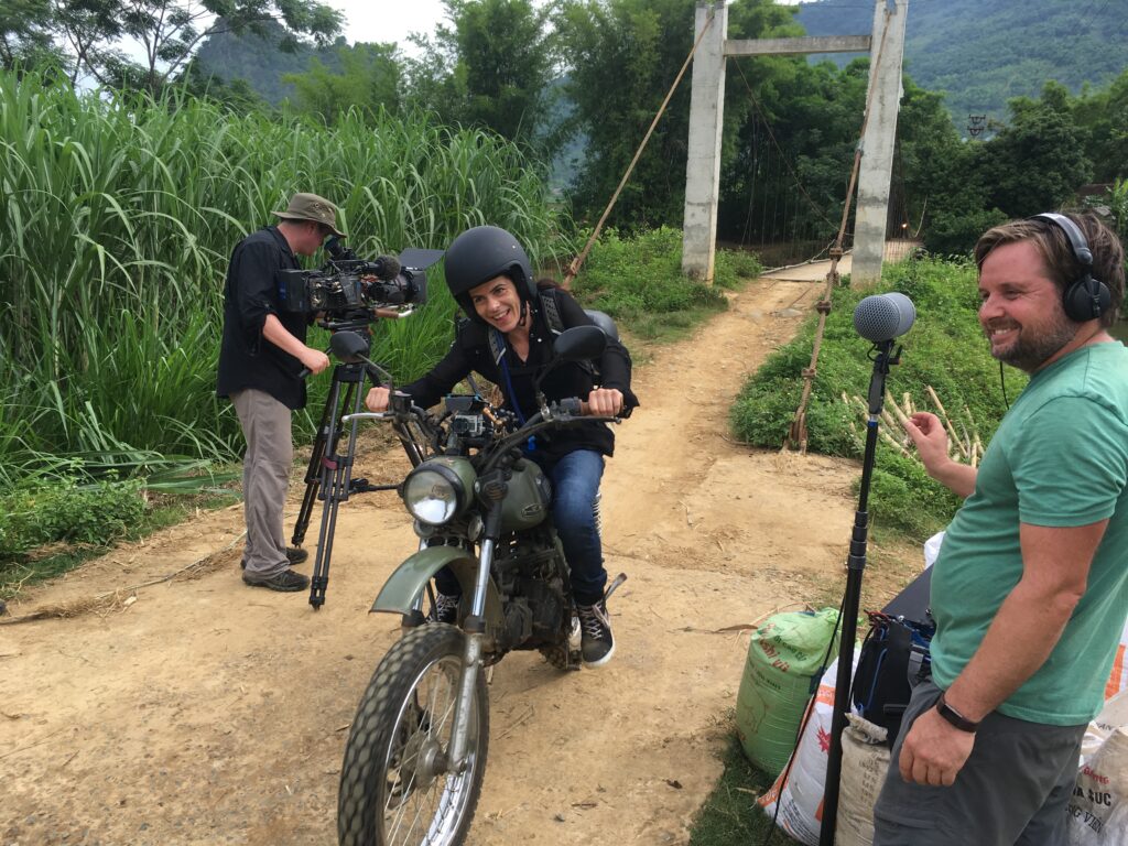 one of the team members from BBC's Without Limits riding across a bridge