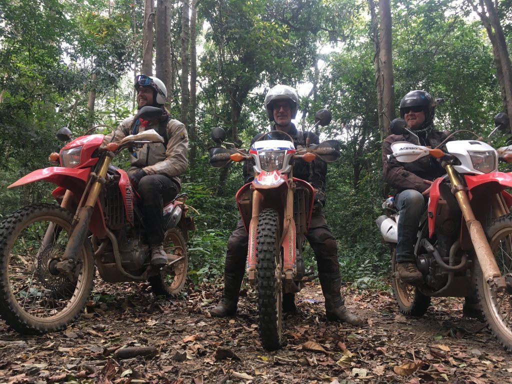 Explore riders in the Laotian jungle