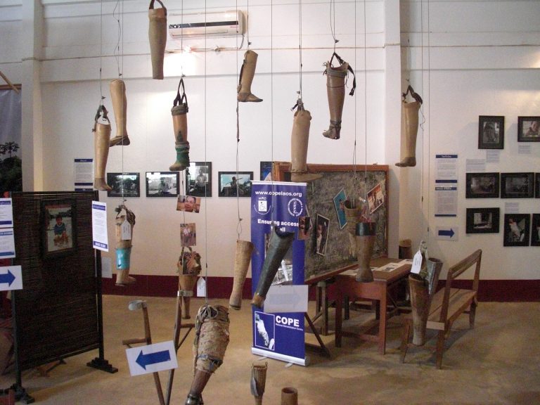 prosthetics hanging from the ceiling in the COPE Laos museum