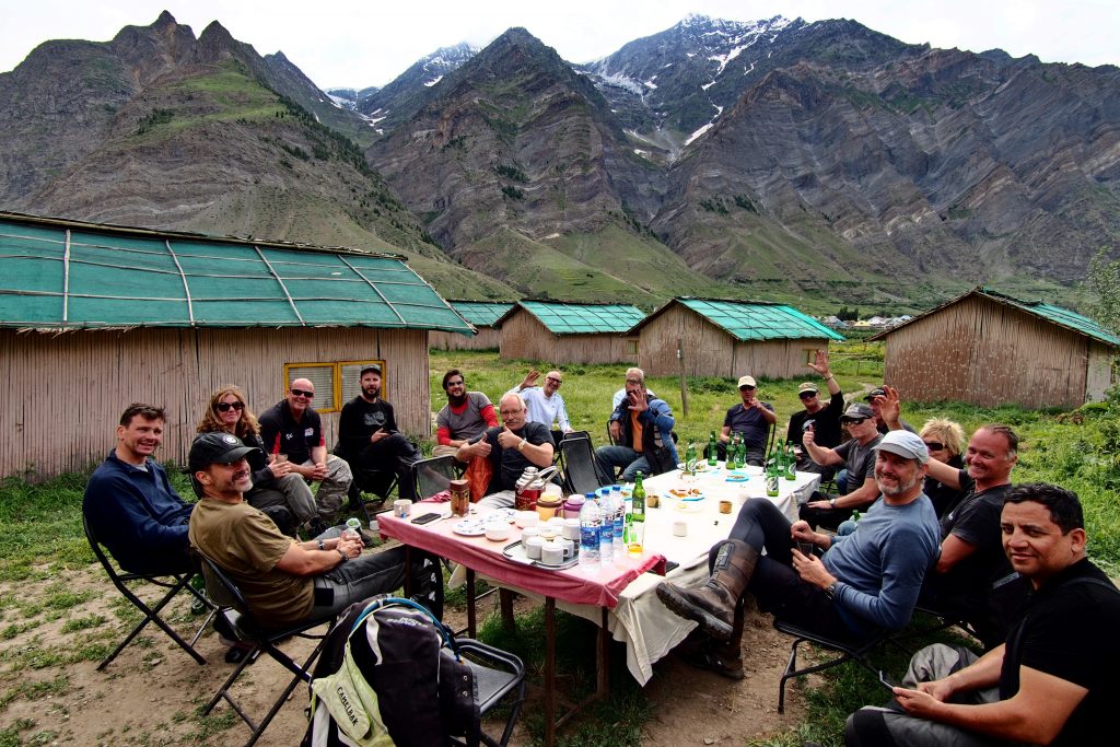 Explore Indochina tour members having dinner in the mountains