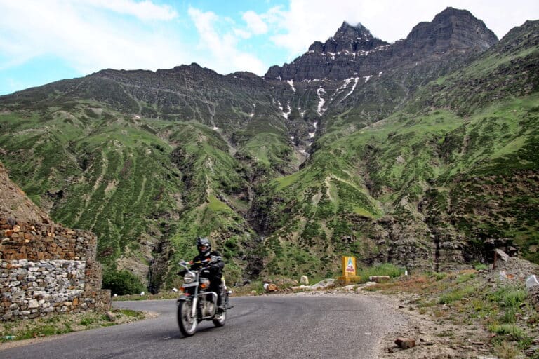 A Himalayas motorcycle tour rider heads out of Keylong in India