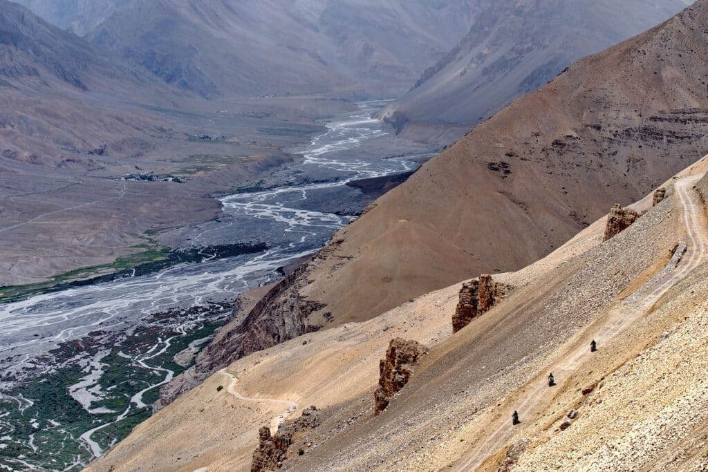 Explore Indochina riders descend into the Spitti Valley during on a motorcycle tour of the Himalayas in India