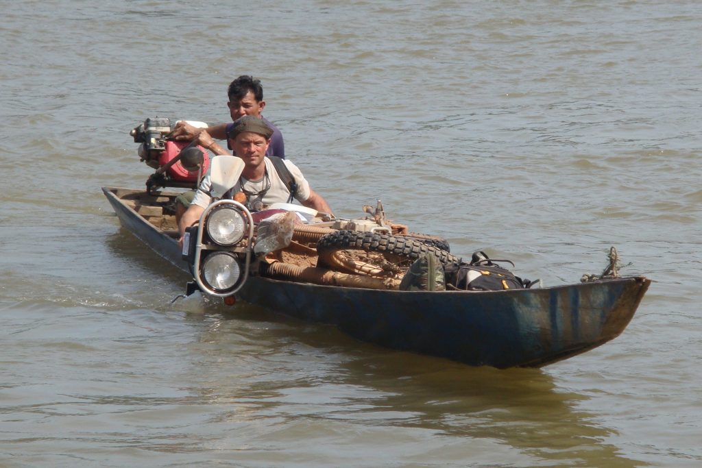river crossing with a motorcycle in Laos