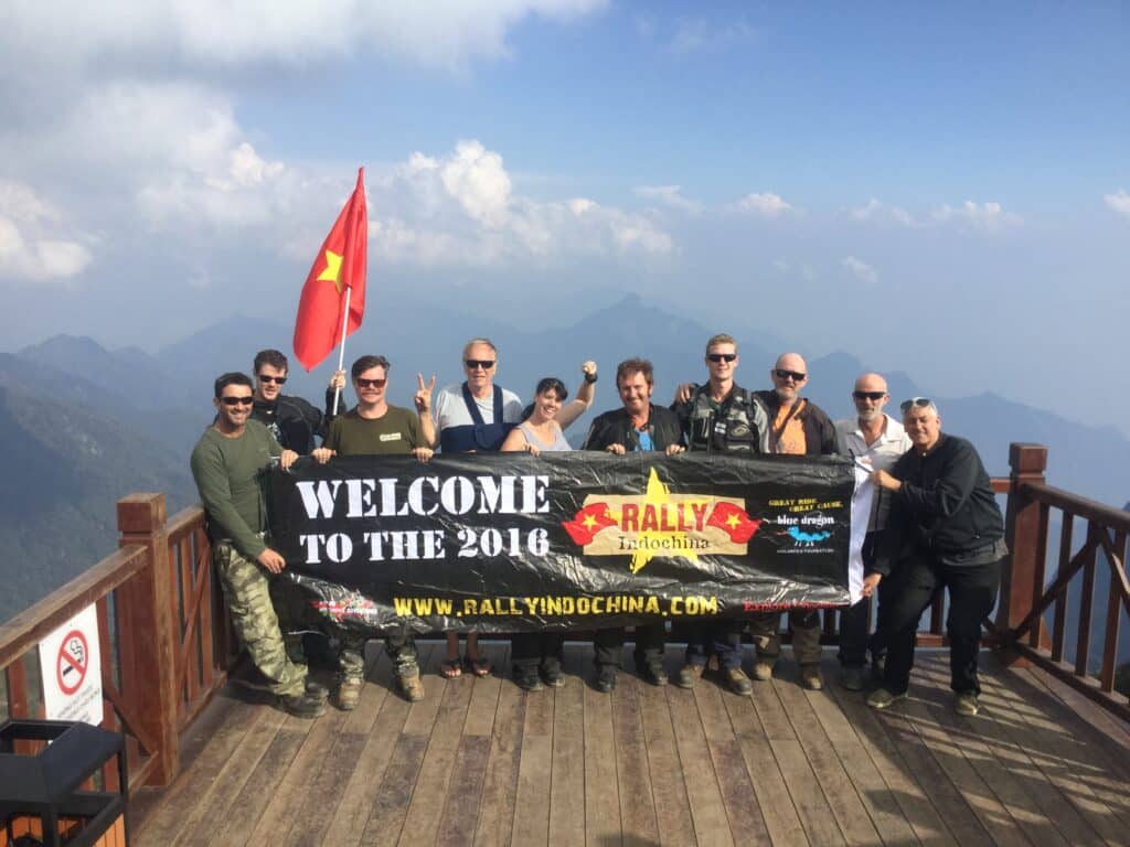 An Explore Indochina motorcycle tour group on top of Fansipan Mountain