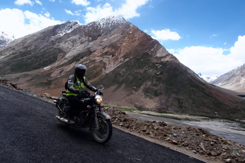 An Explore Indochina rider enjoying a morning ride in the Zanskar Valley on their Himalayas motorcycle tour in India