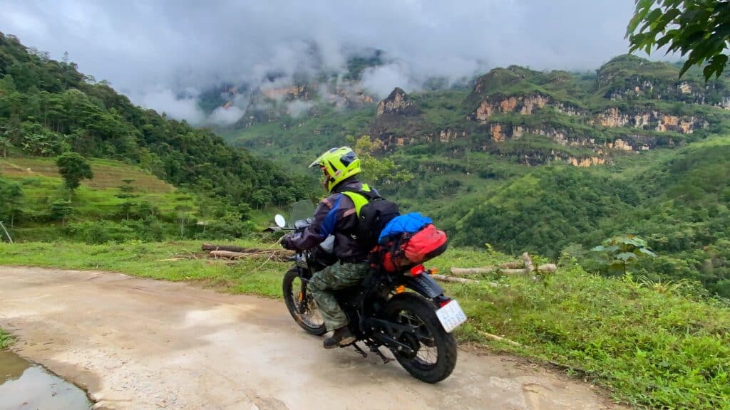 An Explore Indochina rider enjoying mountain roads near Sapa while on Vietnam motorbike tour