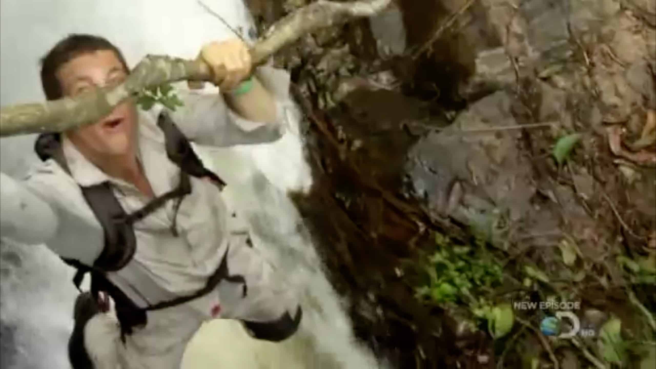 Bear Grylls safety belay rope outline under his clothes