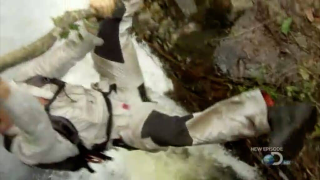 Bear Grylls wears a safety harness