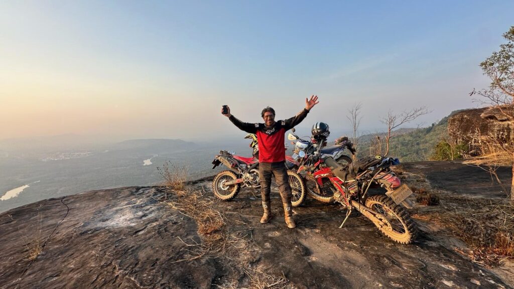 An Explore Indochina rider enjoying challenging trails south of Sepon while riding the Ho Chi Minh Trail in Laos