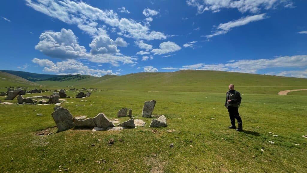 An Explore Indochina rider visits an ancient burial site near Kharkhorin