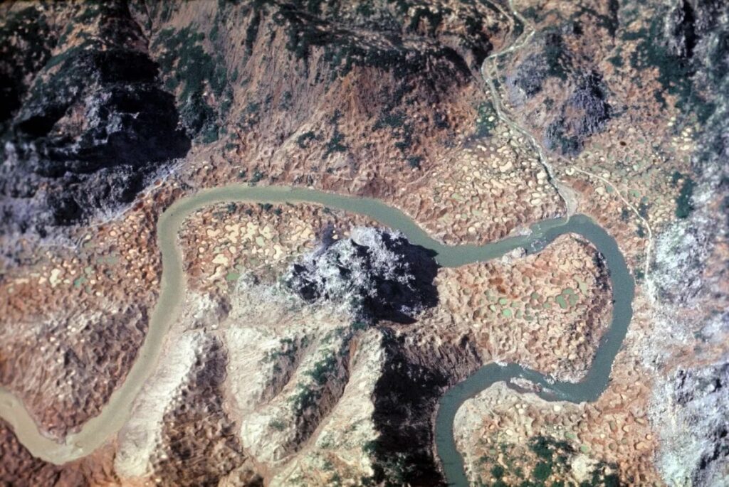 An areal photo of Ban Laboy Ford and the 'Dog's Head' on the Ho Chi Minh Trail that is scared with thousands of bomb craters
