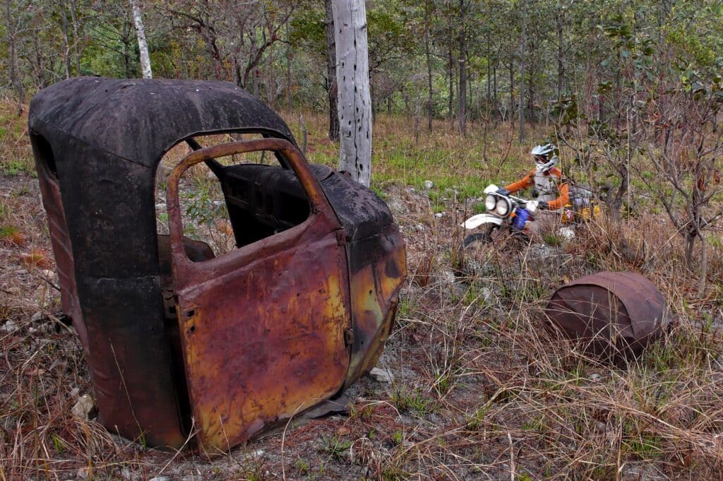 Destroyed trucks seen by an Explore Indochina rider while heading down the Ho Chi Minh Trail in Laos