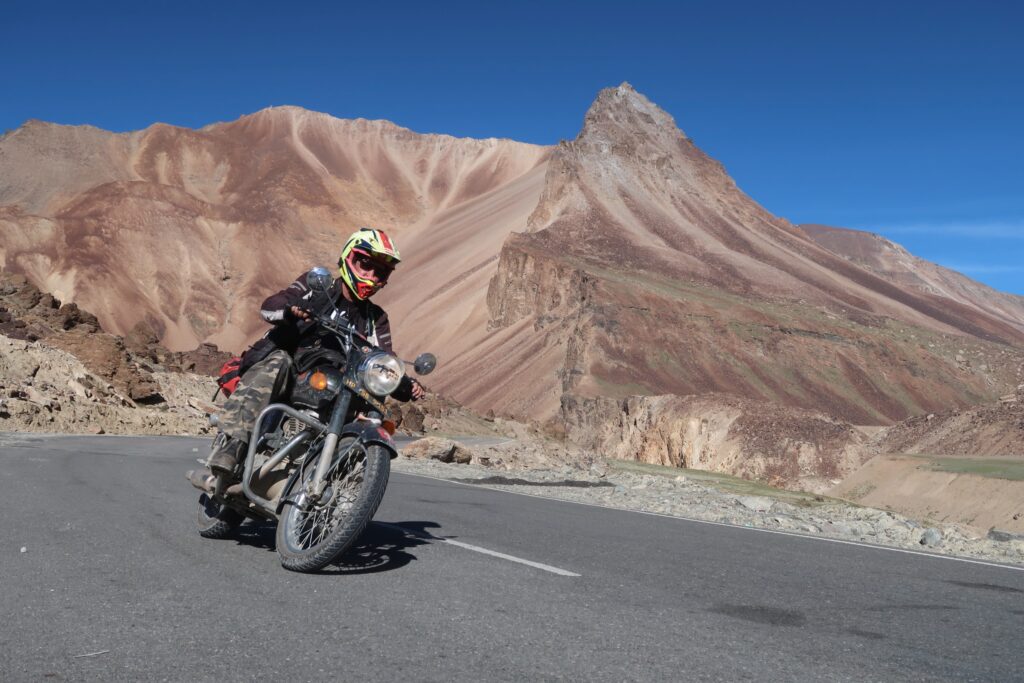 Riding near the Barchala Pass in India while on an Explore Indochina motorcycle tour