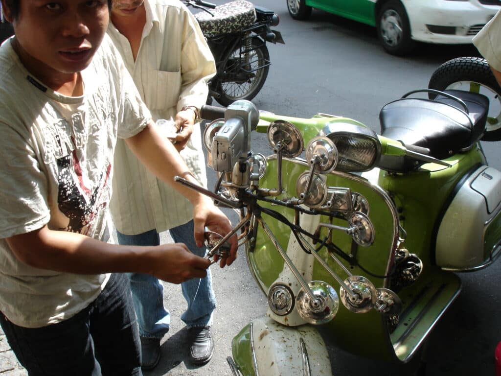 Mirrors are welded onto Jeremy Clarkson's Vespa for the Vietnam Top Gear Special
