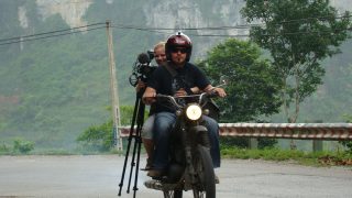Charley Boorman riding with his camera equipment